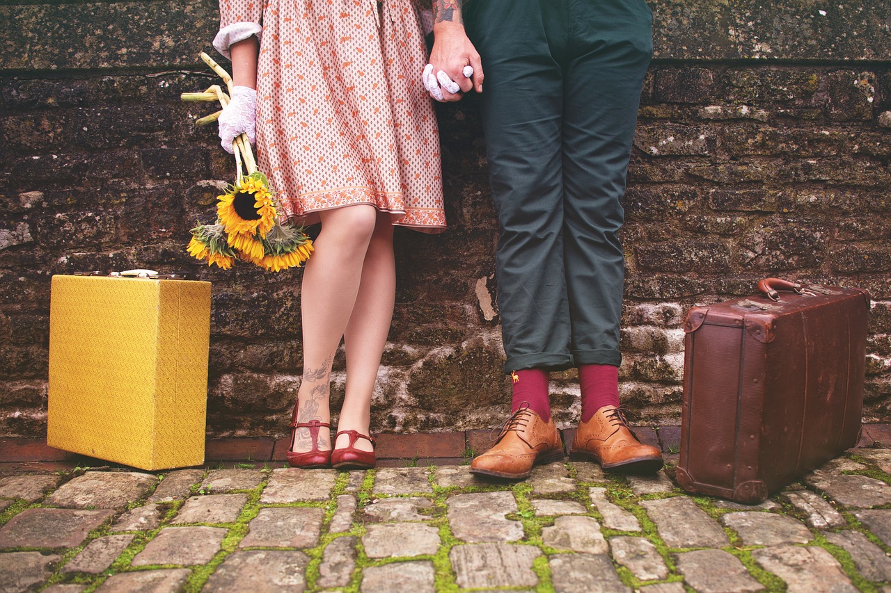 Couples in a healthy relationship locking hands together and posing for a photo